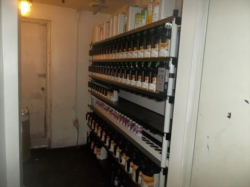 Shelves of paint toners in the paint mixing room
